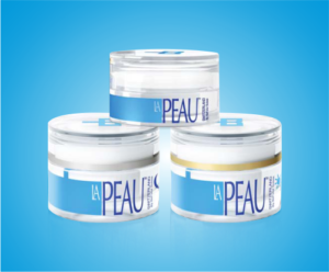 LA PEAU Skincare, the trio set products over blue background. Day cream, night cream and eye contour.